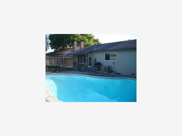 668 Hamann Drive San Jose, CA 95117 - Photo 8 of 8 a picture of a living room with a yard