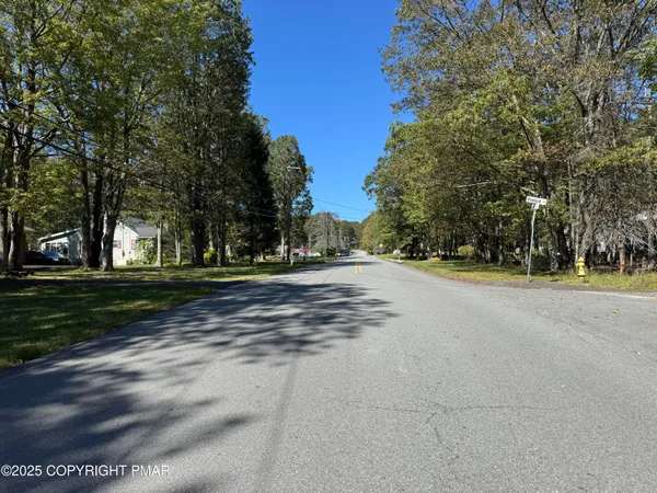 a view of road with trees