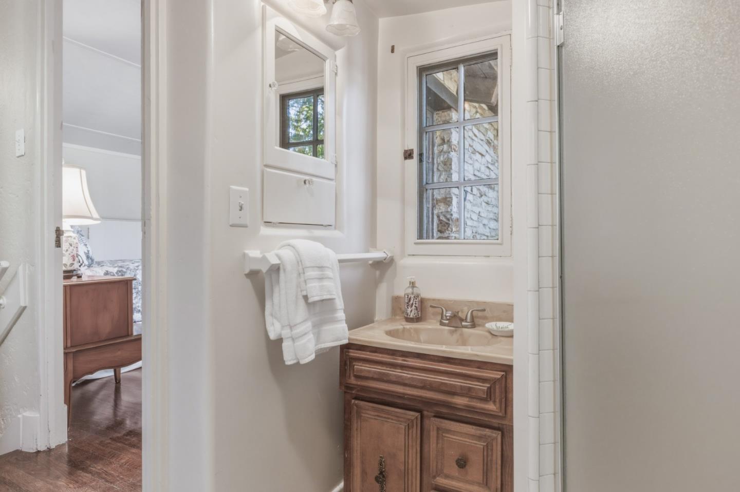 25286 Hatton Road Carmel, CA 93923 - Photo 23 of 34 a bathroom with a sink and a mirror