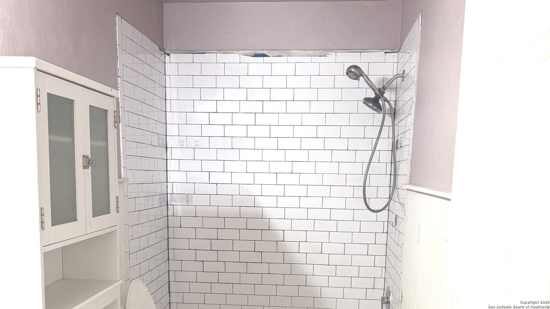 907 Dove Avenue Devine, TX 78016 - Photo 4 of 8 a bathroom with a shower