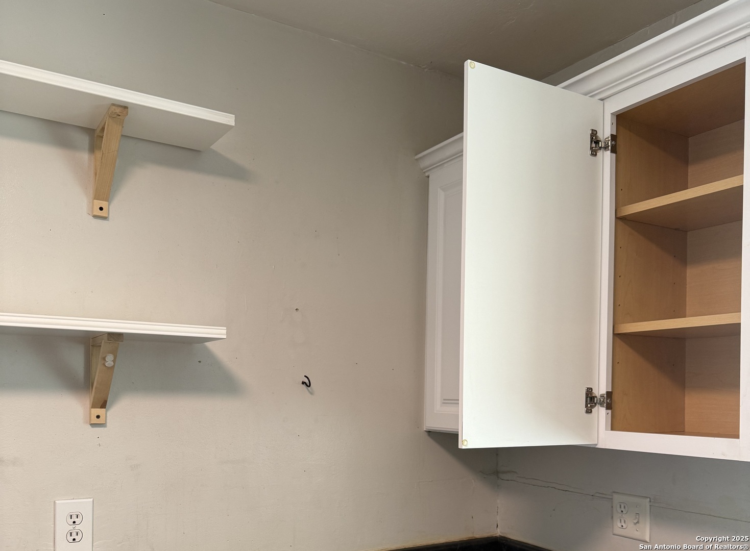 907 Dove Avenue Devine, TX 78016 - Photo 6 of 8 a view of an empty walk in closet