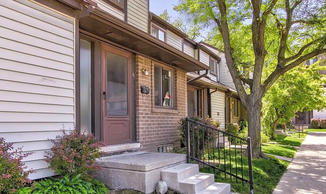 100 Hazelcrest Place Hazel Park, MI 48030 - Photo 4 of 10 a front view of a house with a garden