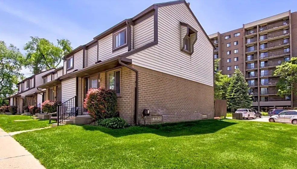 100 Hazelcrest Place Hazel Park, MI 48030 - Photo 6 of 10 a front view of a house with a garden