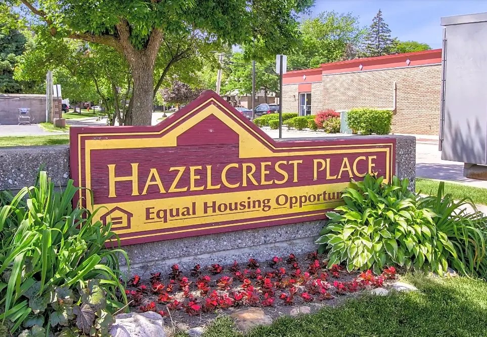 100 Hazelcrest Place Hazel Park, MI 48030 - Photo 7 of 10 a sign on the side of a building