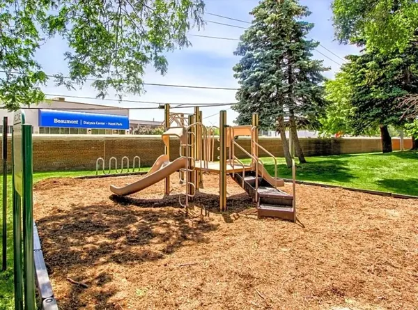 a view of a park with swings