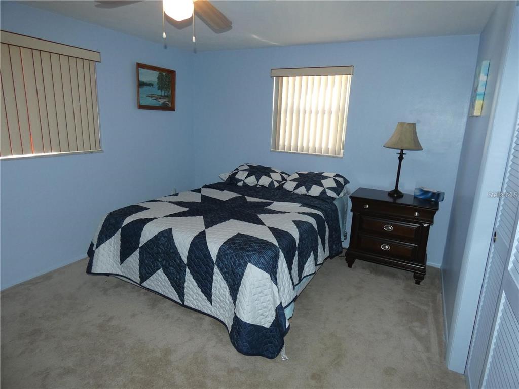 4392 Craftsbury Drive New Port Richey, FL 34652 - Photo 20 of 41 a bedroom with a bed and a window