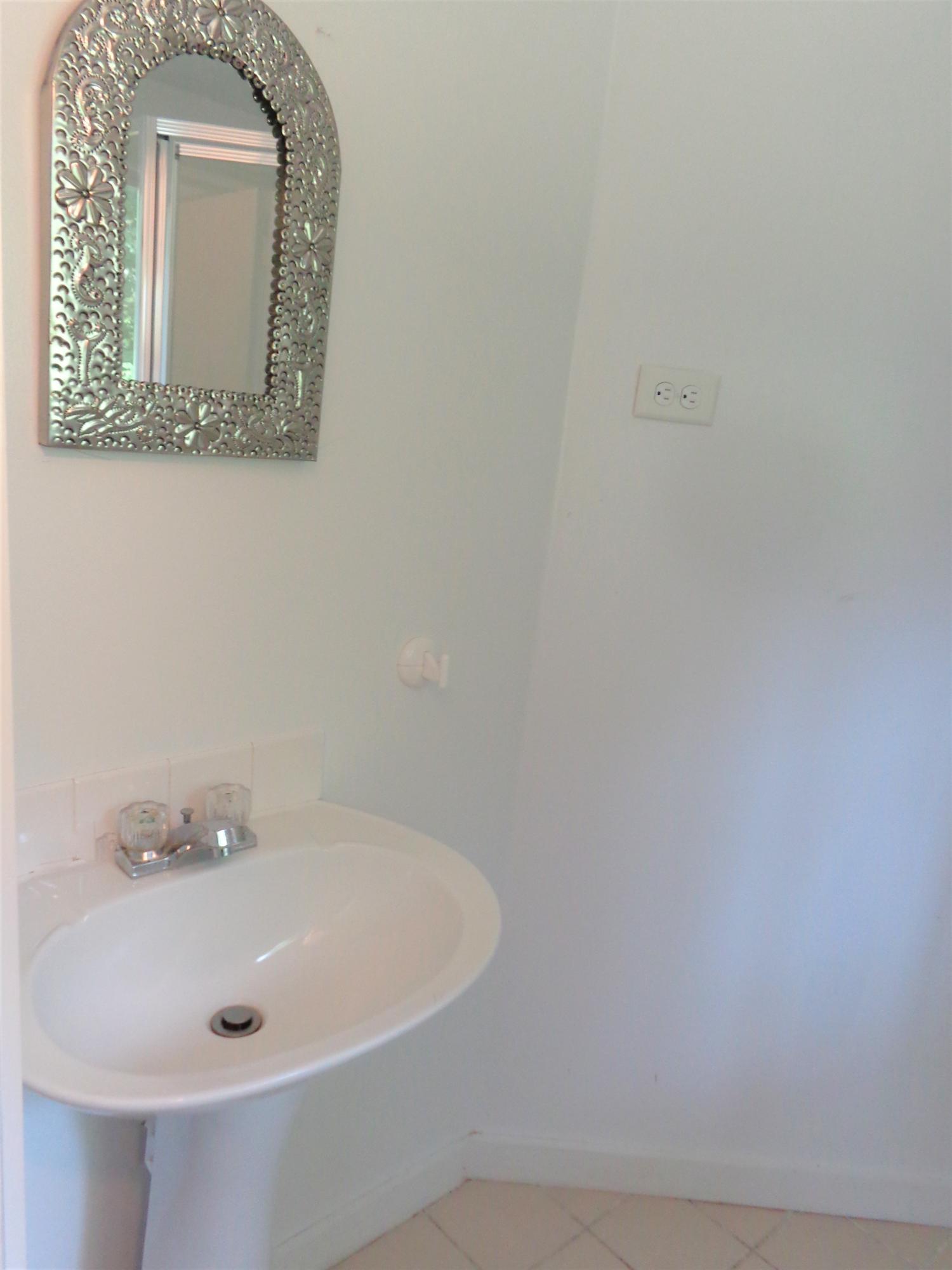 20 Baker Road, Unit C Wellfleet, MA 02667 - Photo 12 of 19 a bathroom with a white tub and a sink