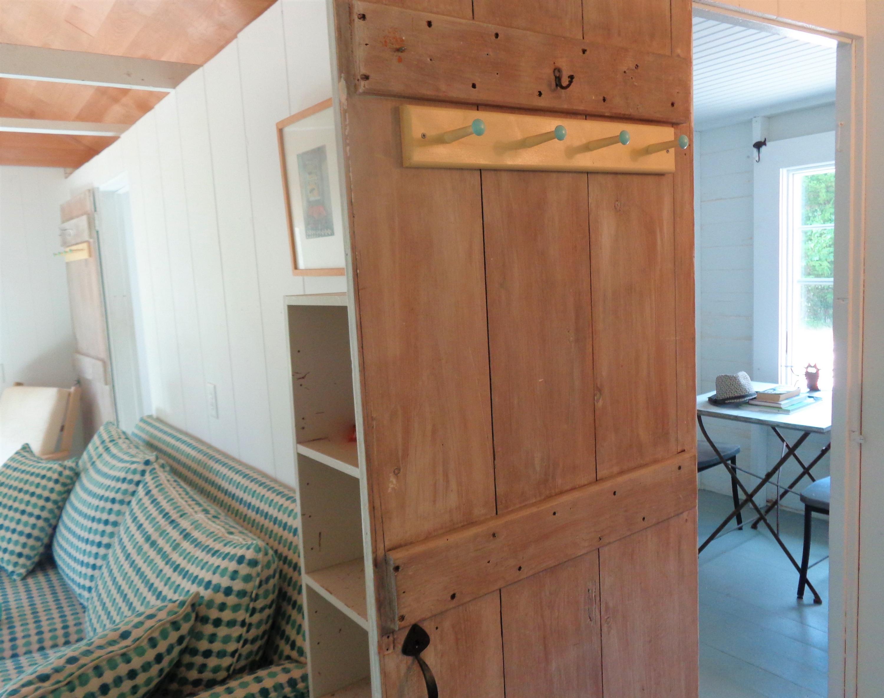 20 Baker Road, Unit C Wellfleet, MA 02667 - Photo 13 of 19 a bedroom with a bed and a table in it