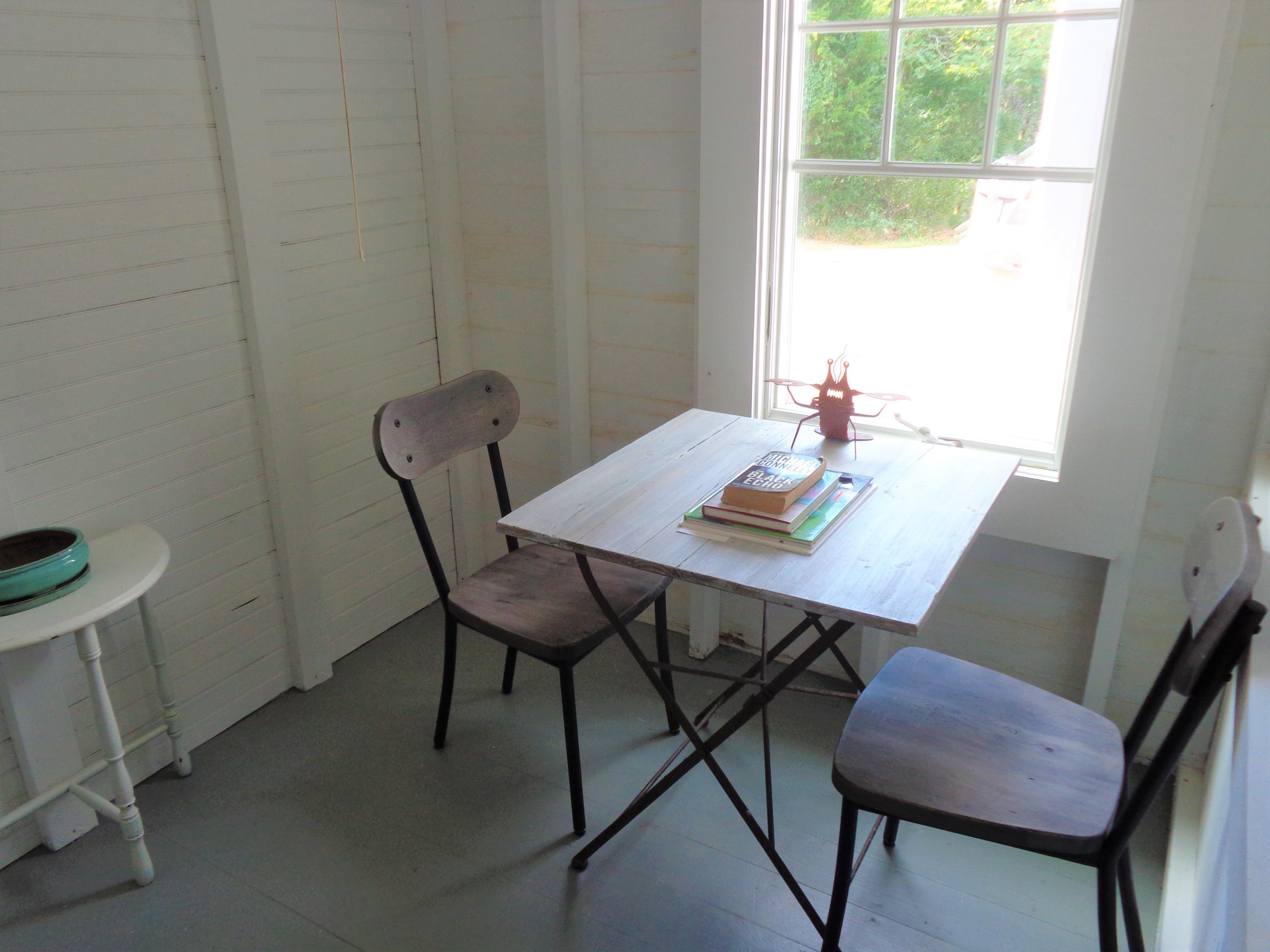 20 Baker Road, Unit C Wellfleet, MA 02667 - Photo 14 of 19 a view of a workspace with a table and chairs in a room