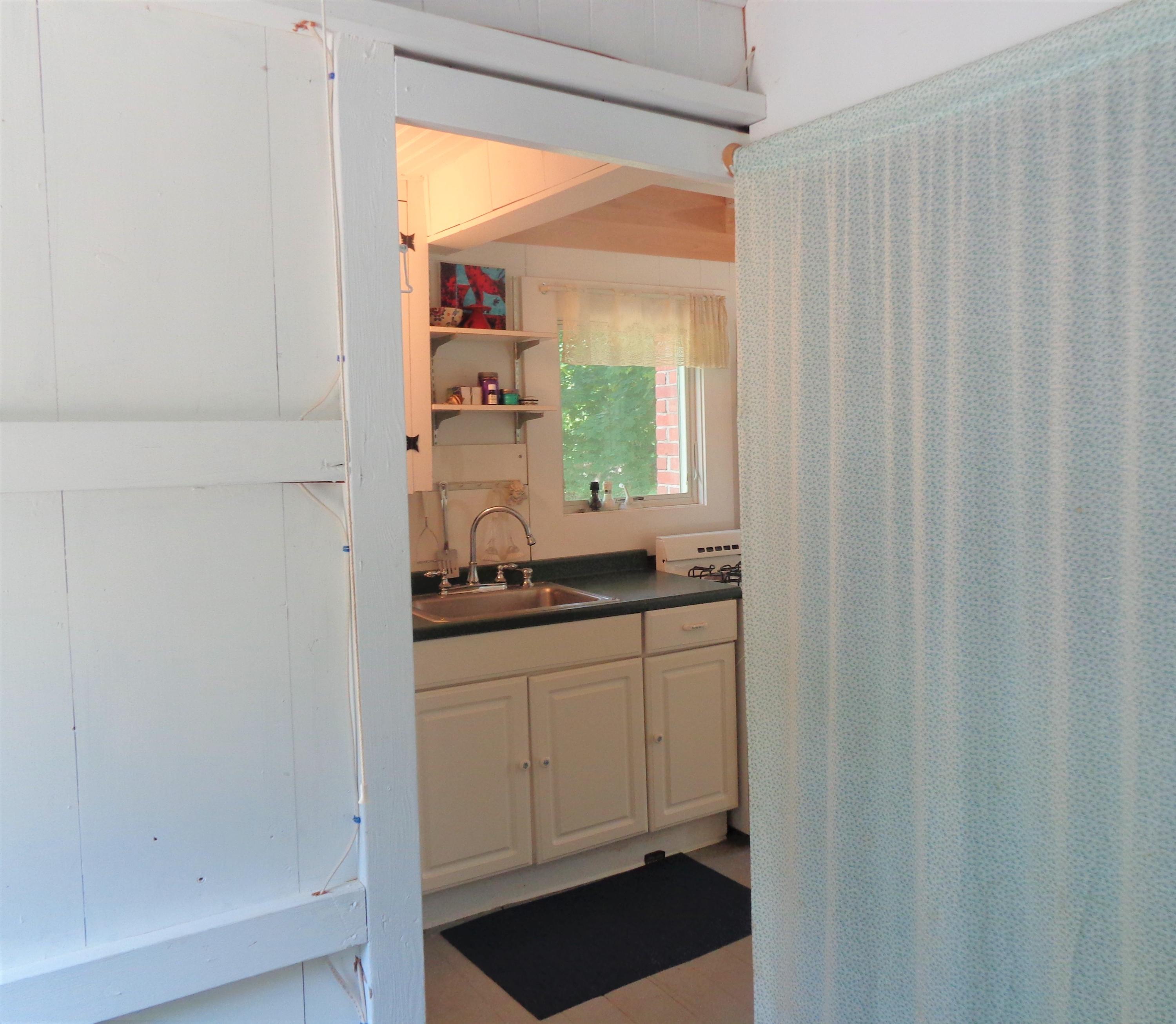 20 Baker Road, Unit C Wellfleet, MA 02667 - Photo 16 of 19 a kitchen with a sink and a window