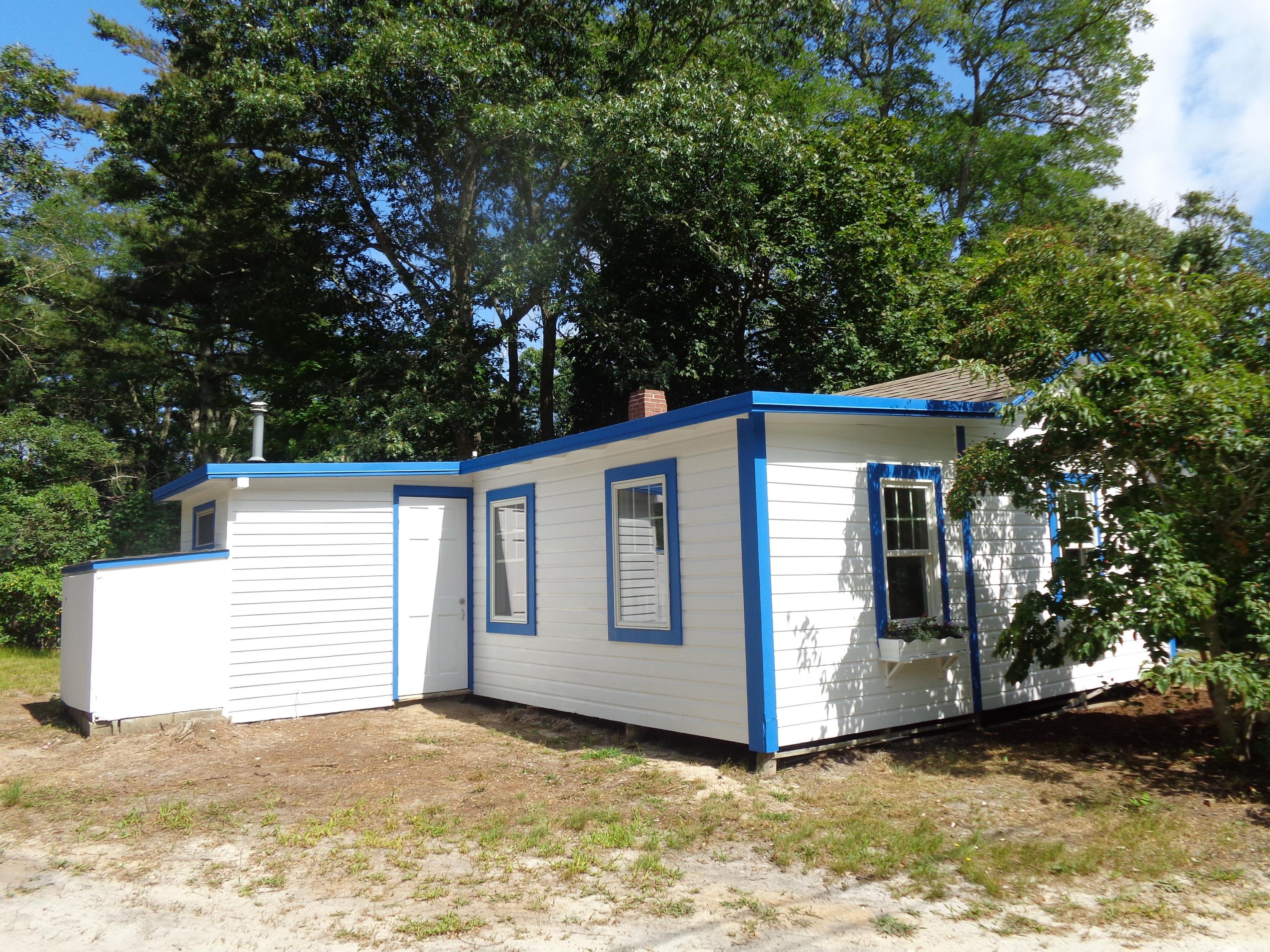 20 Baker Road, Unit C Wellfleet, MA 02667 - Photo 18 of 19 a view of a house with a large tree