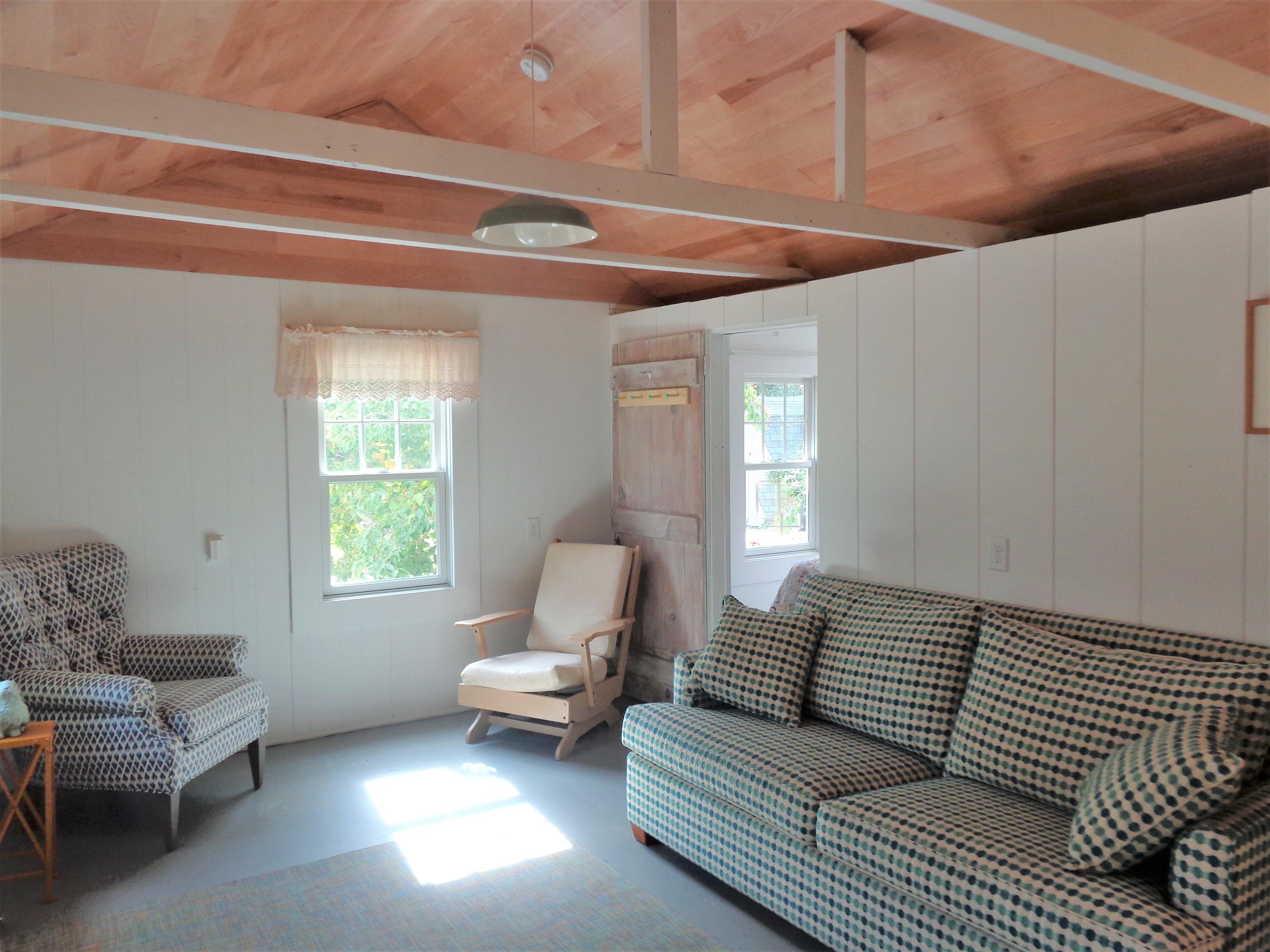 20 Baker Road, Unit C Wellfleet, MA 02667 - Photo 4 of 19 a living room with furniture and a window