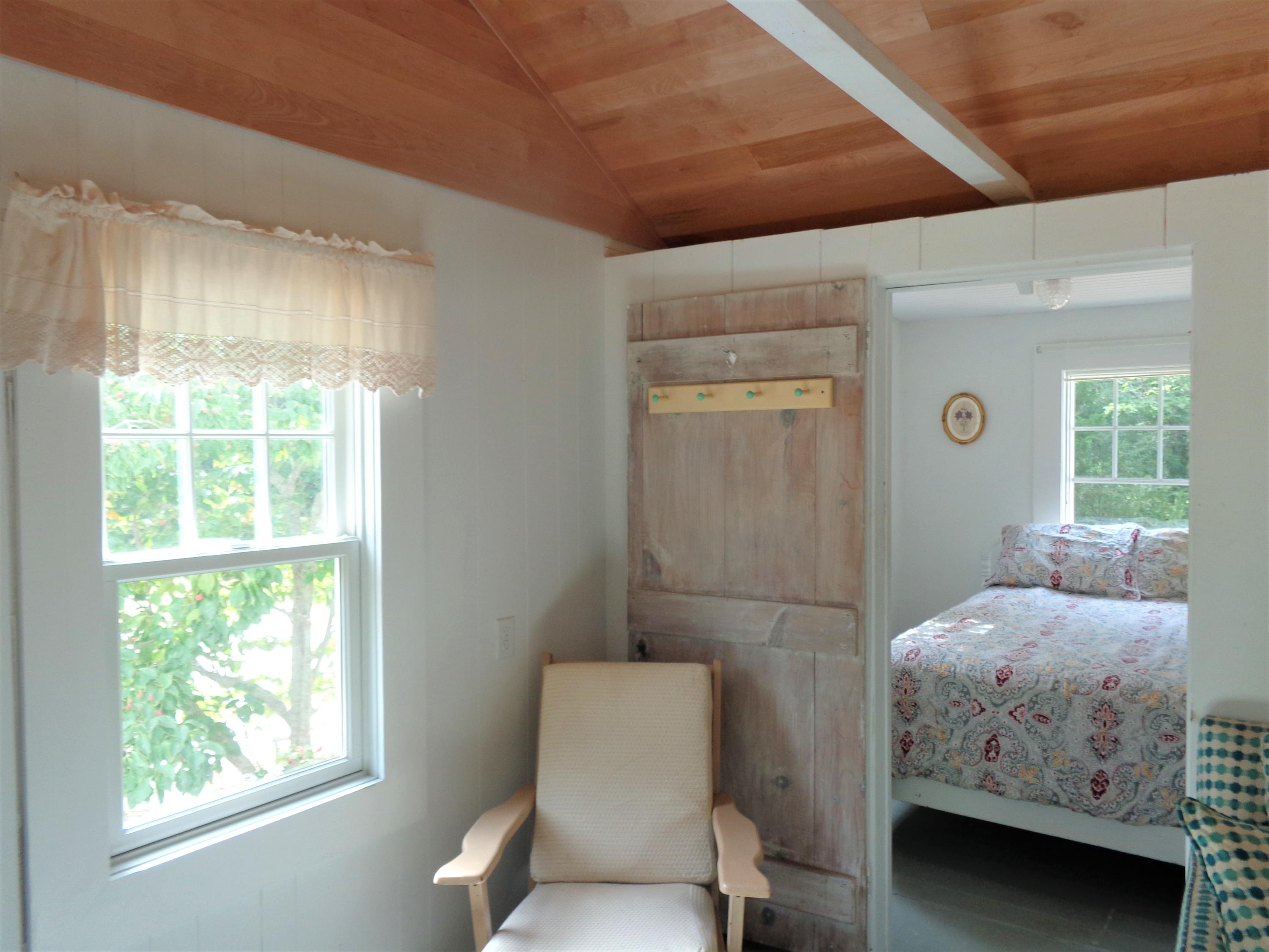 20 Baker Road, Unit C Wellfleet, MA 02667 - Photo 5 of 19 a bedroom with a bed and a window