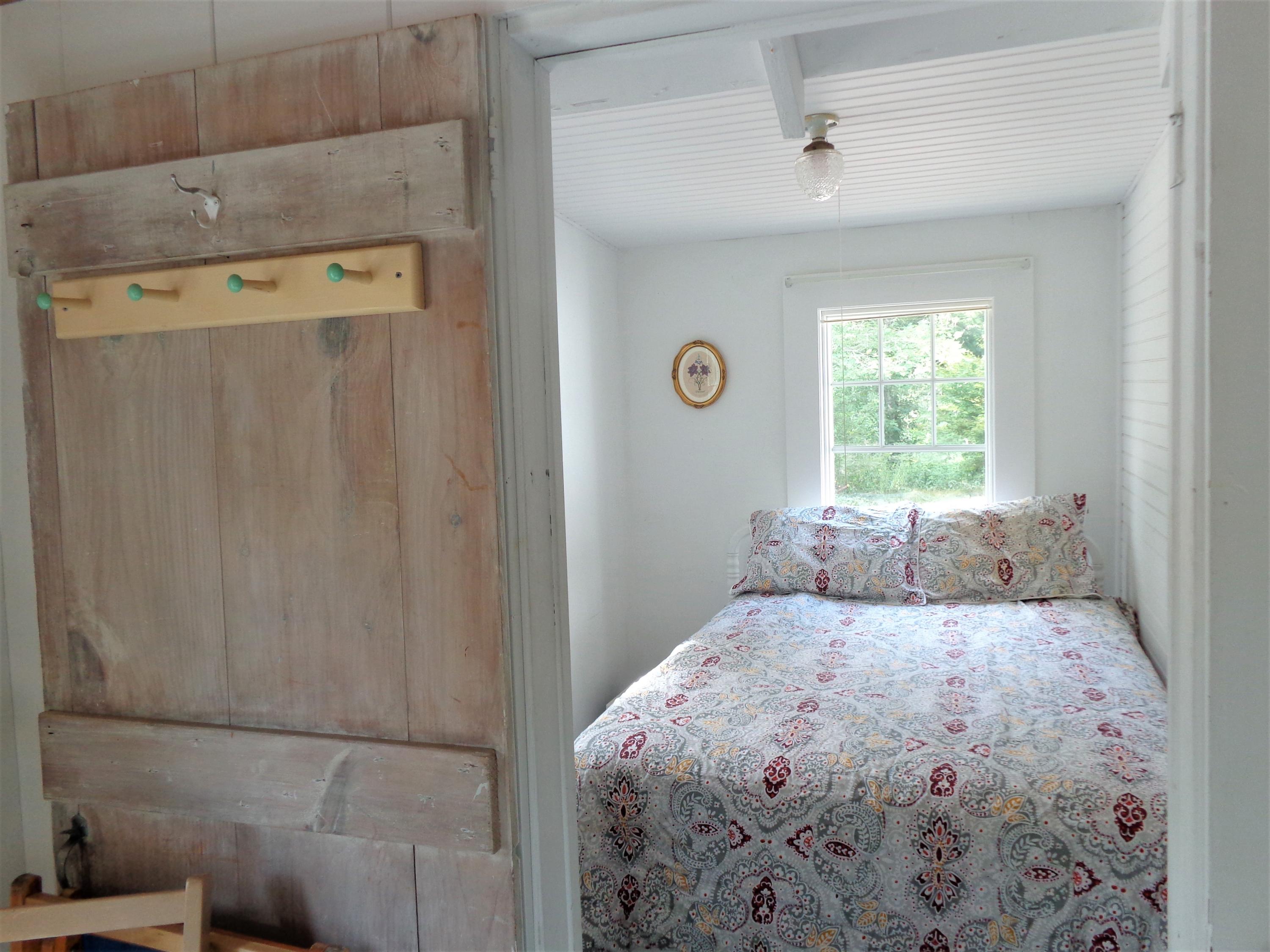 20 Baker Road, Unit C Wellfleet, MA 02667 - Photo 6 of 19 a bedroom with a bed and a window