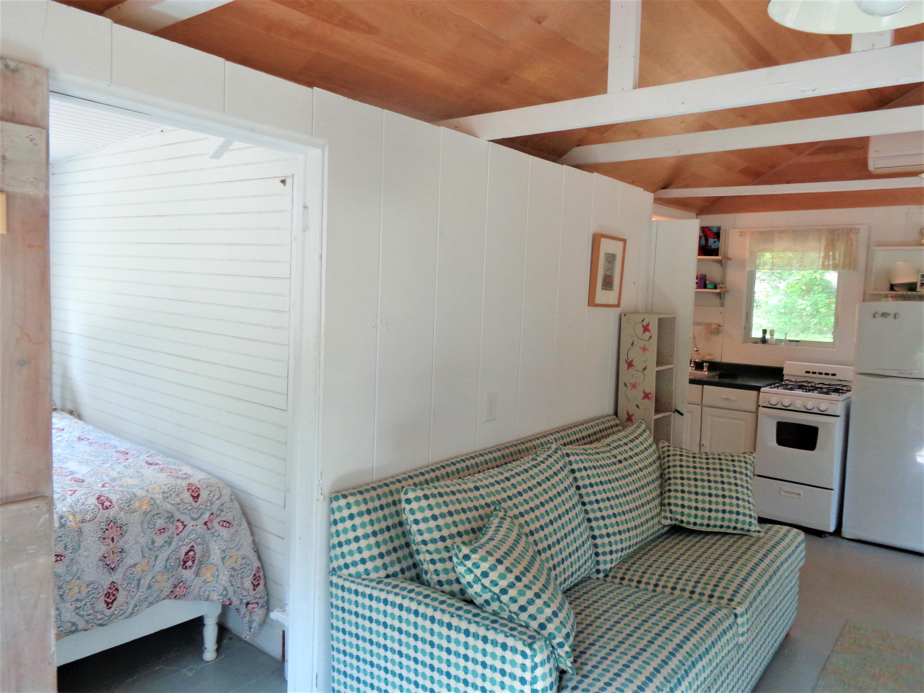 20 Baker Road, Unit C Wellfleet, MA 02667 - Photo 7 of 19 a bedroom with a bed and a window