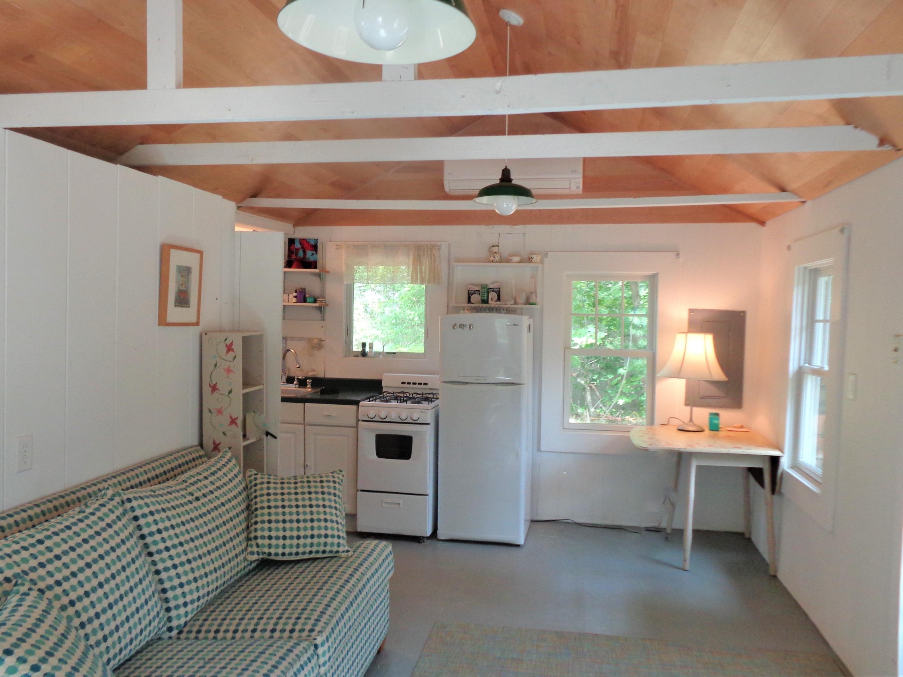 20 Baker Road, Unit C Wellfleet, MA 02667 - Photo 8 of 19 a kitchen with a sink and a stove top oven