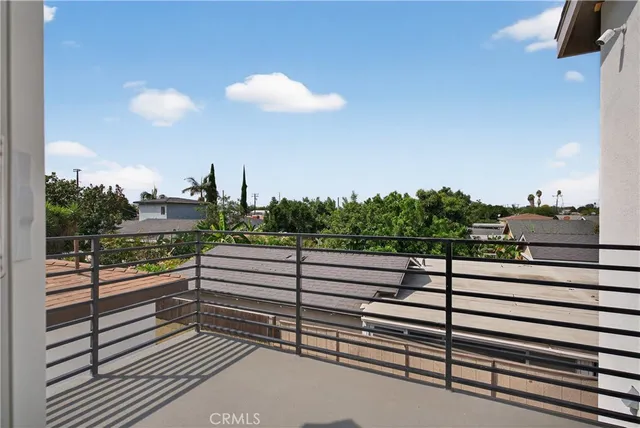 a view of a balcony with a patio
