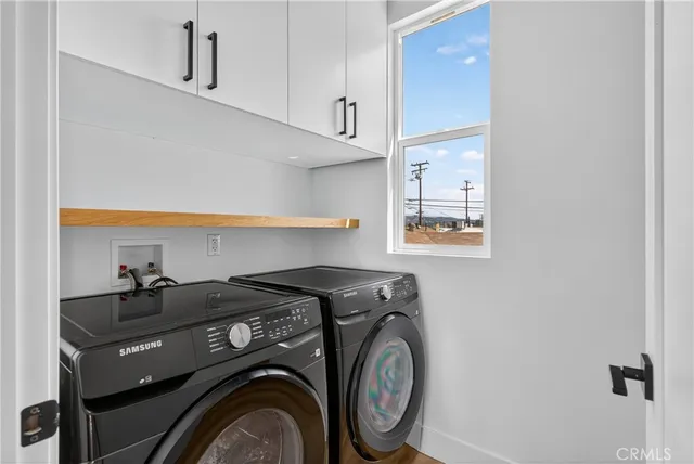 a utility room with closet dryer and washer