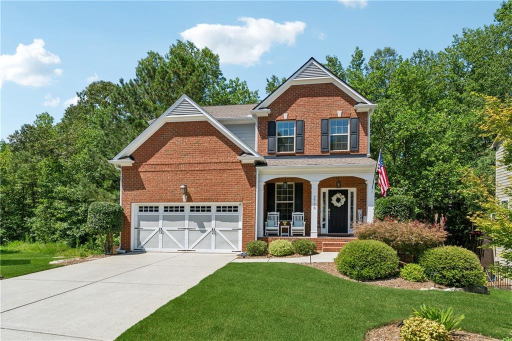 2770 Lansing Lane Cumming, GA 30041 - Photo 2 of 49 a front view of a house with a yard