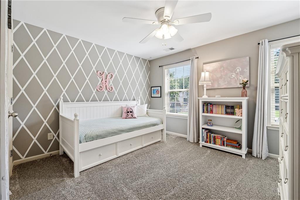 2770 Lansing Lane Cumming, GA 30041 - Photo 23 of 49 a living room with a bed and a window