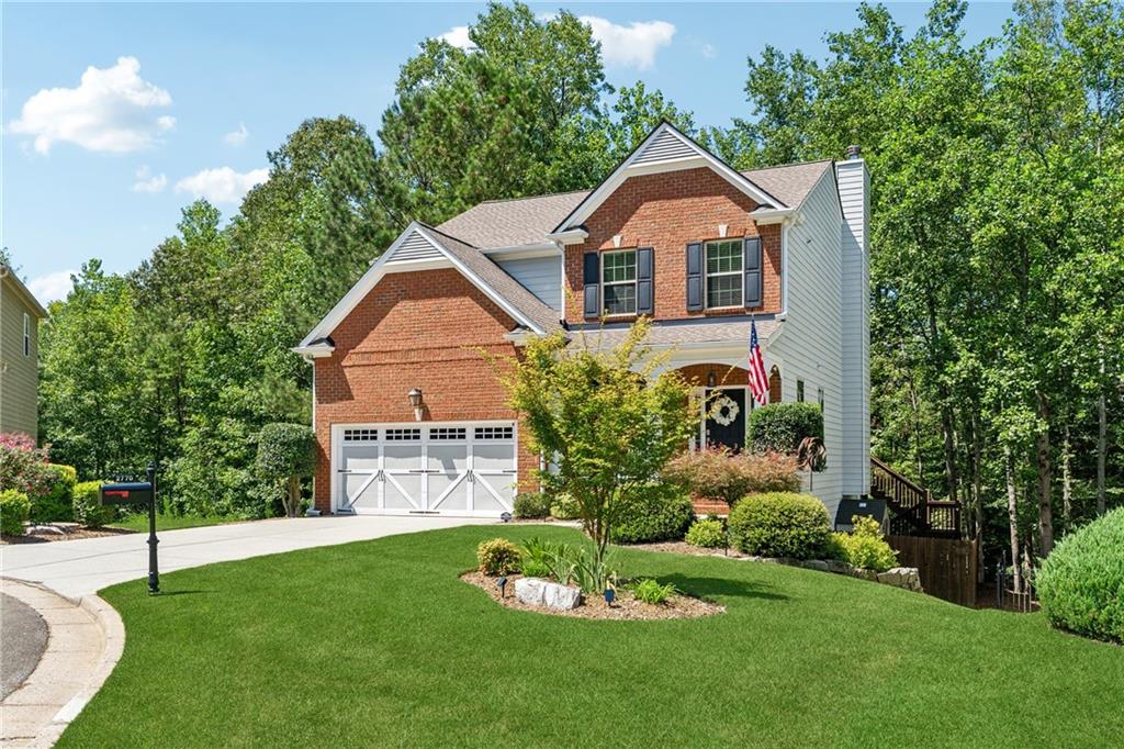 2770 Lansing Lane Cumming, GA 30041 - Photo 3 of 49 a front view of a house with a yard
