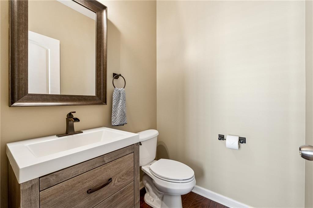 2770 Lansing Lane Cumming, GA 30041 - Photo 31 of 49 a bathroom with a sink toilet and mirror