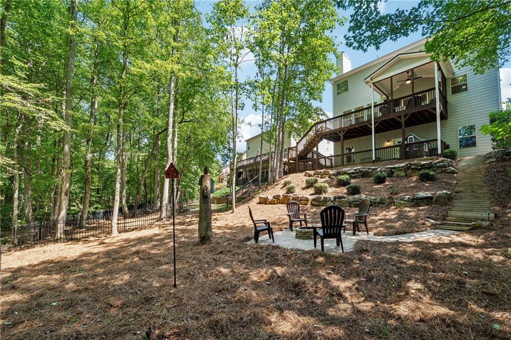 2770 Lansing Lane Cumming, GA 30041 - Photo 38 of 49 a view of a house with backyard and sitting area