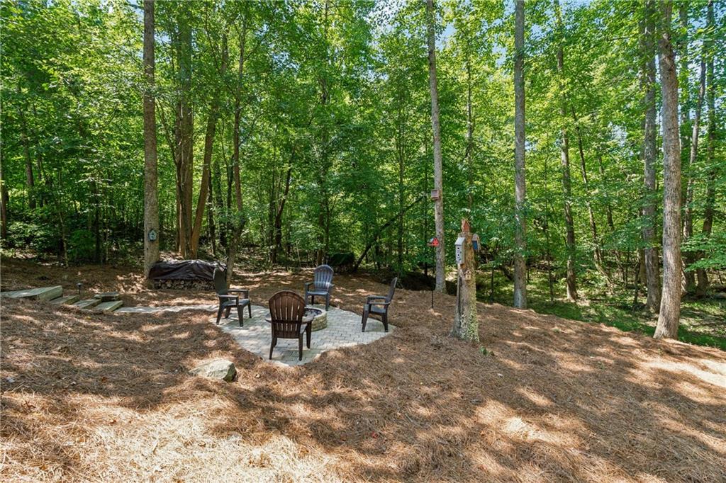 2770 Lansing Lane Cumming, GA 30041 - Photo 39 of 49 a view of a bench in a forest