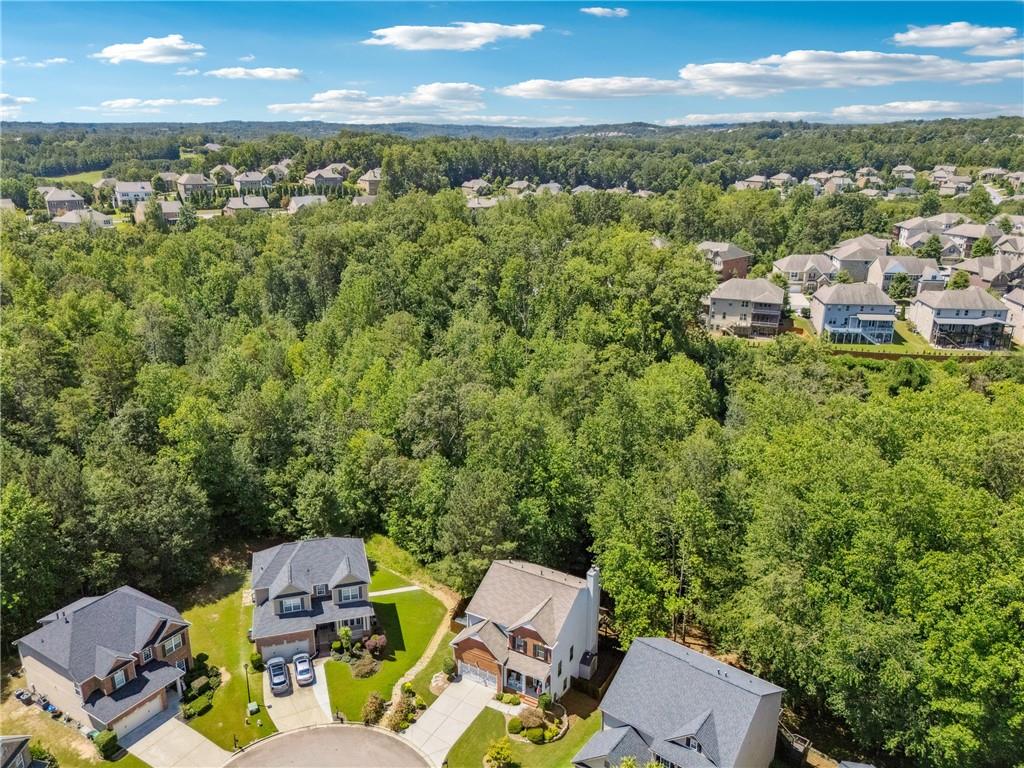 2770 Lansing Lane Cumming, GA 30041 - Photo 43 of 49 a view of a city with lawn chairs under an umbrella