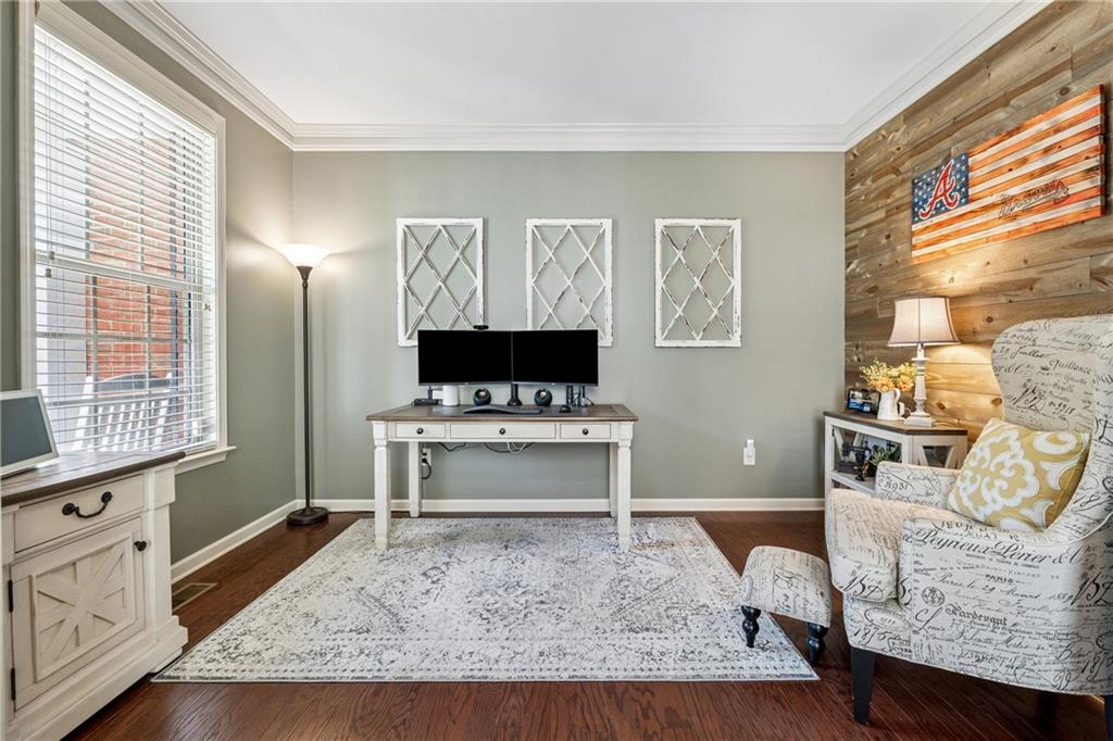 2770 Lansing Lane Cumming, GA 30041 - Photo 5 of 49 a living room with furniture and a flat screen tv