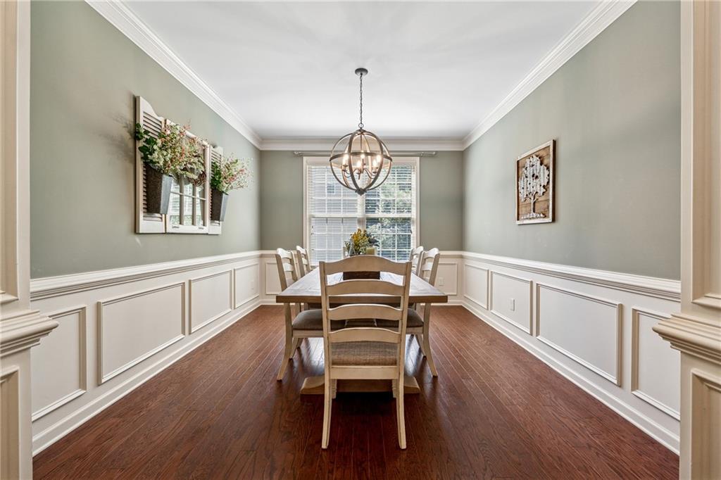 2770 Lansing Lane Cumming, GA 30041 - Photo 7 of 49 a living room with furniture a window and wooden floor