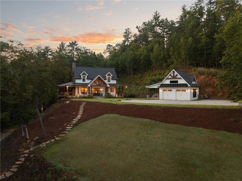 a view of houses with trees and city view