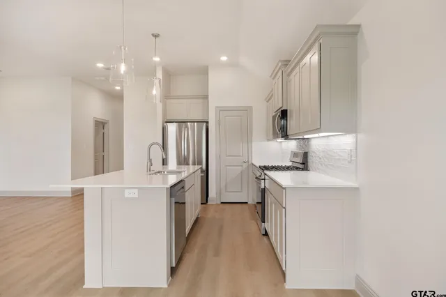 a bathroom with a double vanity sink a and a mirror