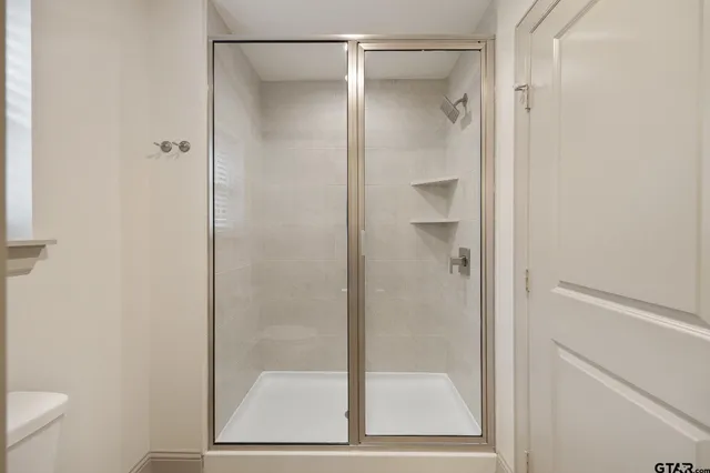 a view of an empty walk in closet