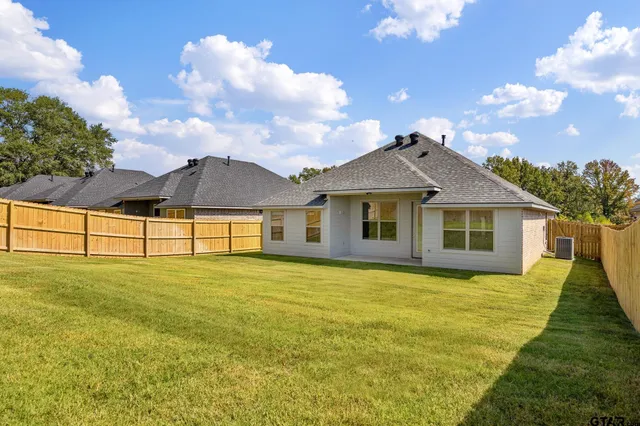 a big house with swimming pool in front of it