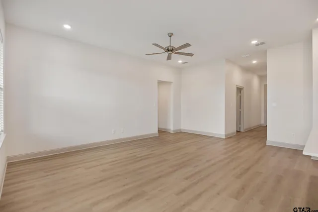 a view of kitchen with cabinets and wooden floor