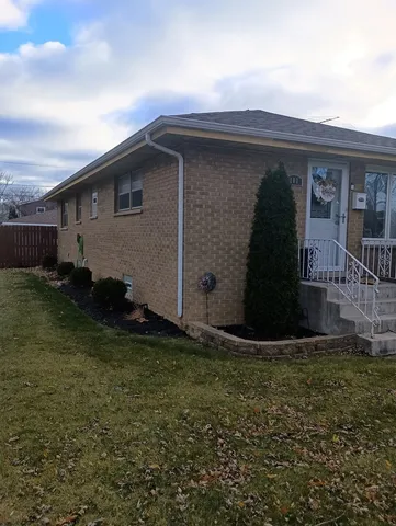 a house with yard in front of it