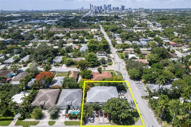 an aerial view of residential houses with outdoor space