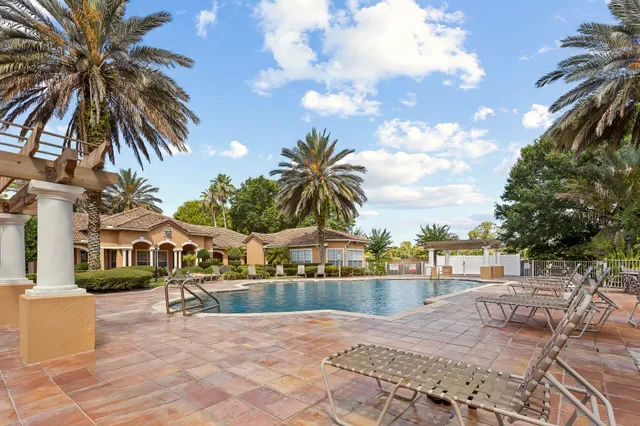 a view of a swimming pool with a table and chairs