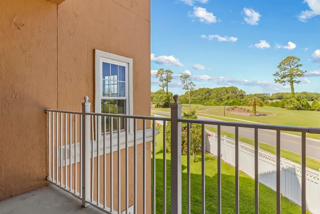 a view of balcony with furniture