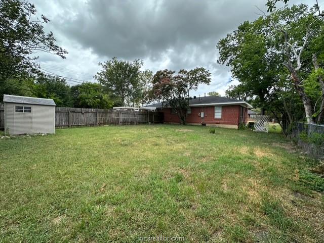 313 Laurel Street Bryan, TX 77801 - Photo 12 of 16 a view of a house with a yard and sitting area