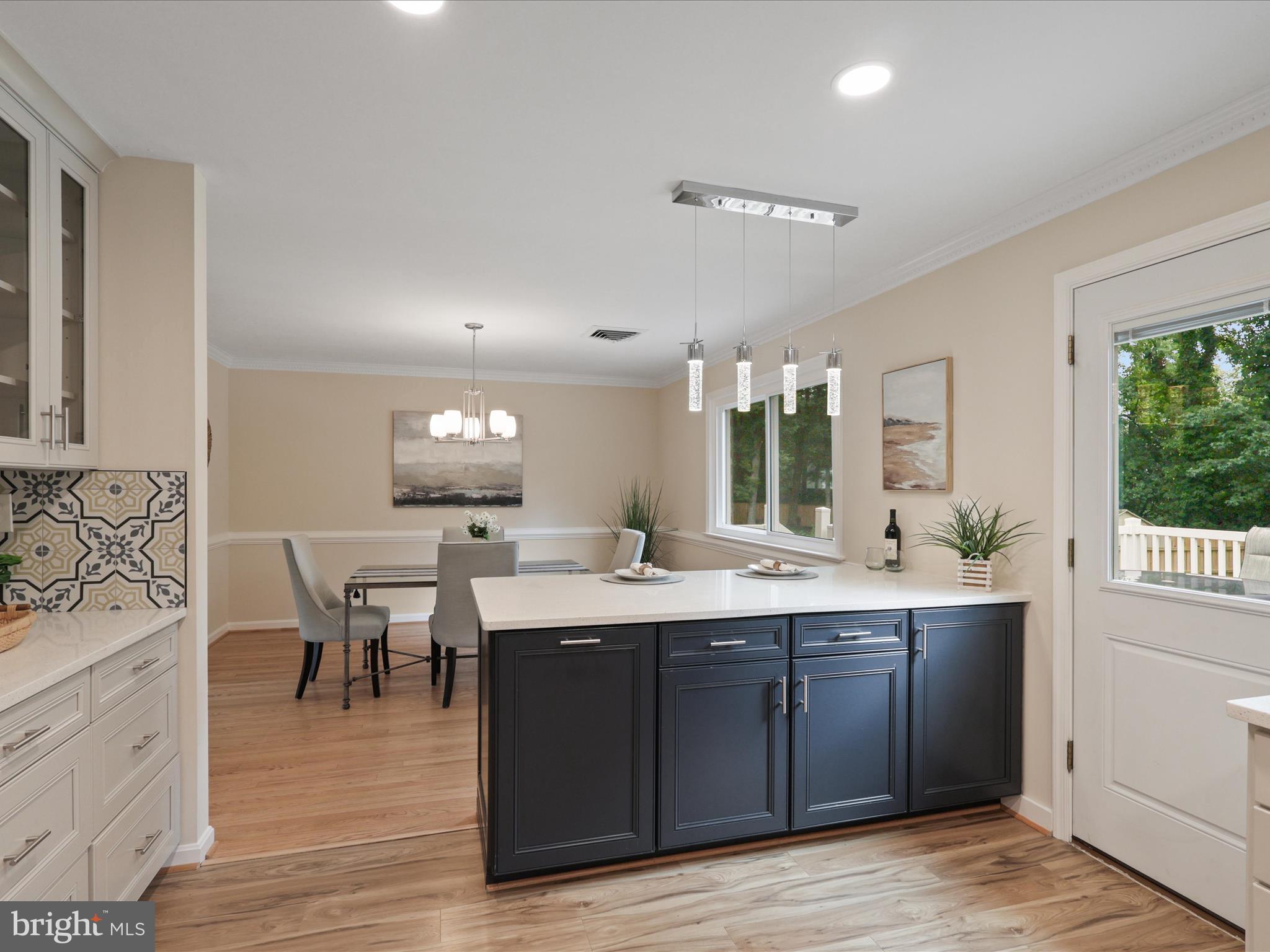 4417 Laurel Road Alexandria, VA 22309 - Photo 13 of 46 a view with a sink and dining room with wooden floor