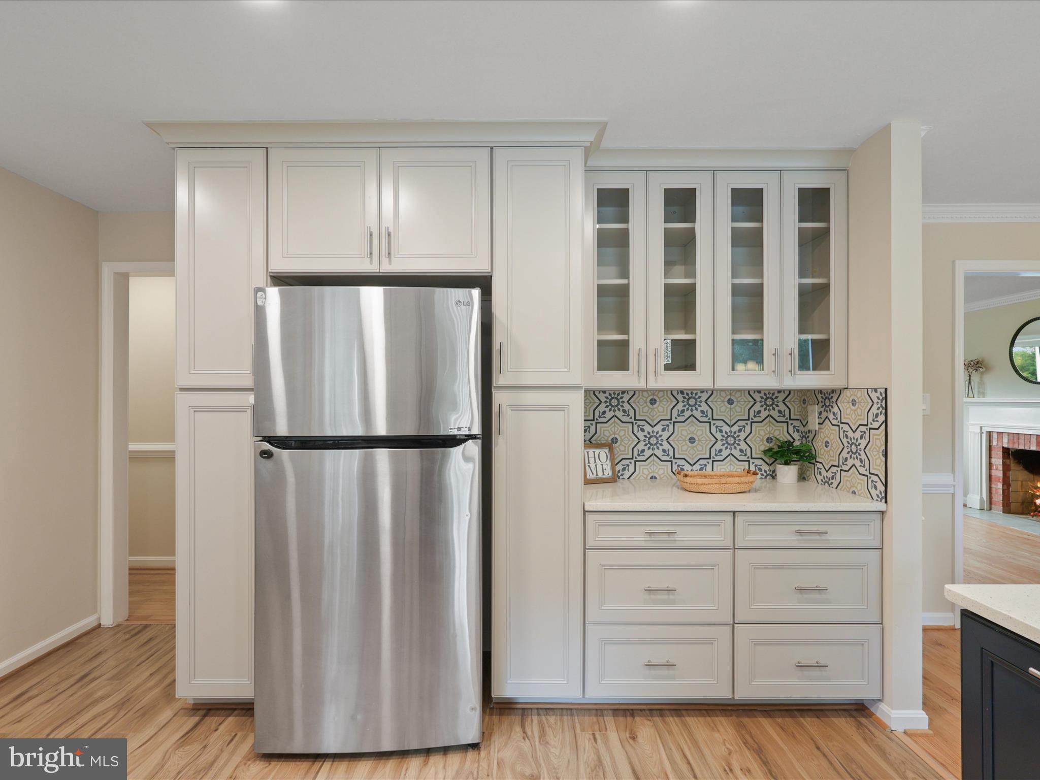 4417 Laurel Road Alexandria, VA 22309 - Photo 14 of 46 a kitchen with a refrigerator and cabinets
