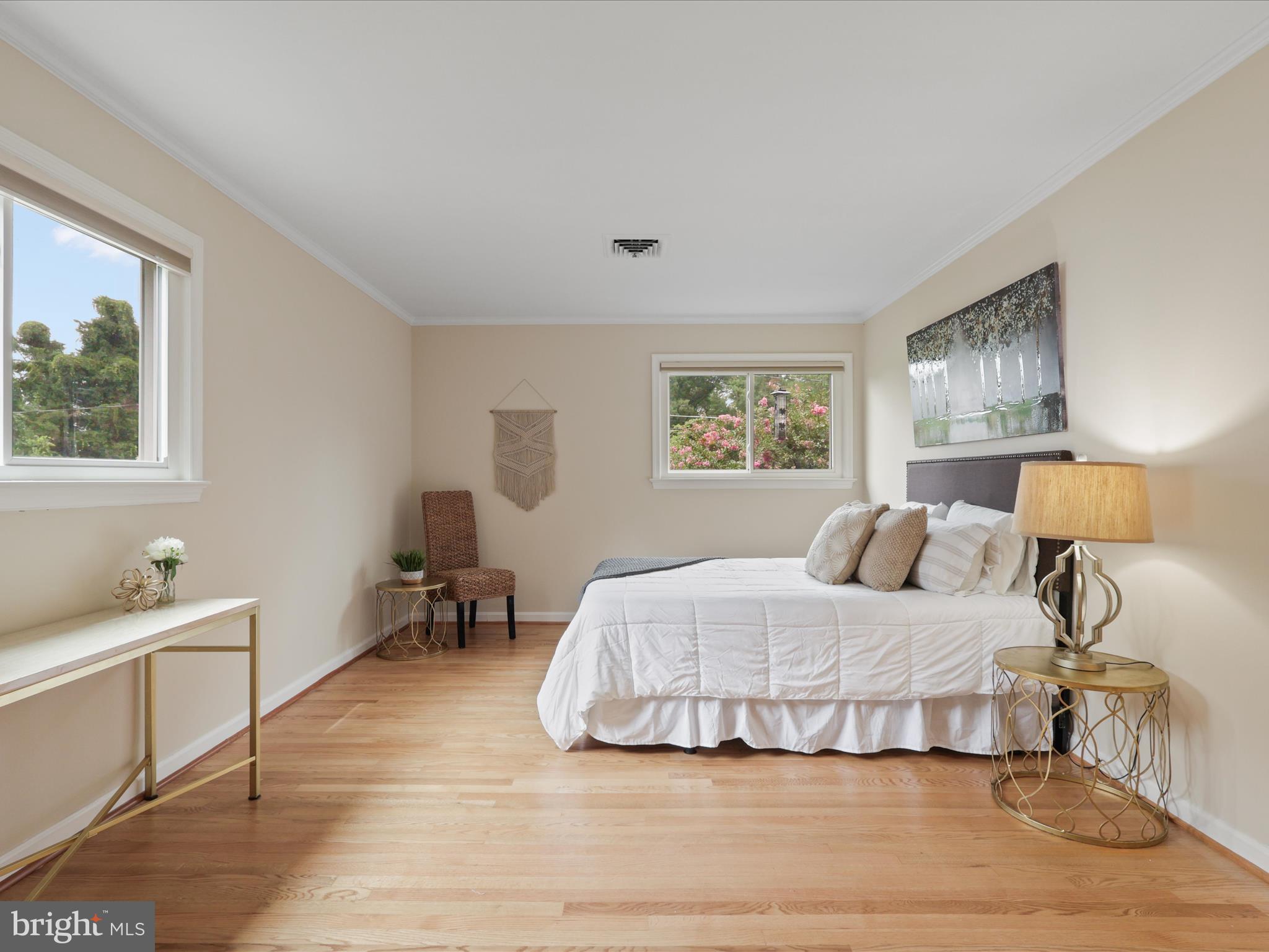4417 Laurel Road Alexandria, VA 22309 - Photo 16 of 46 a bedroom with a large bed and a lamp