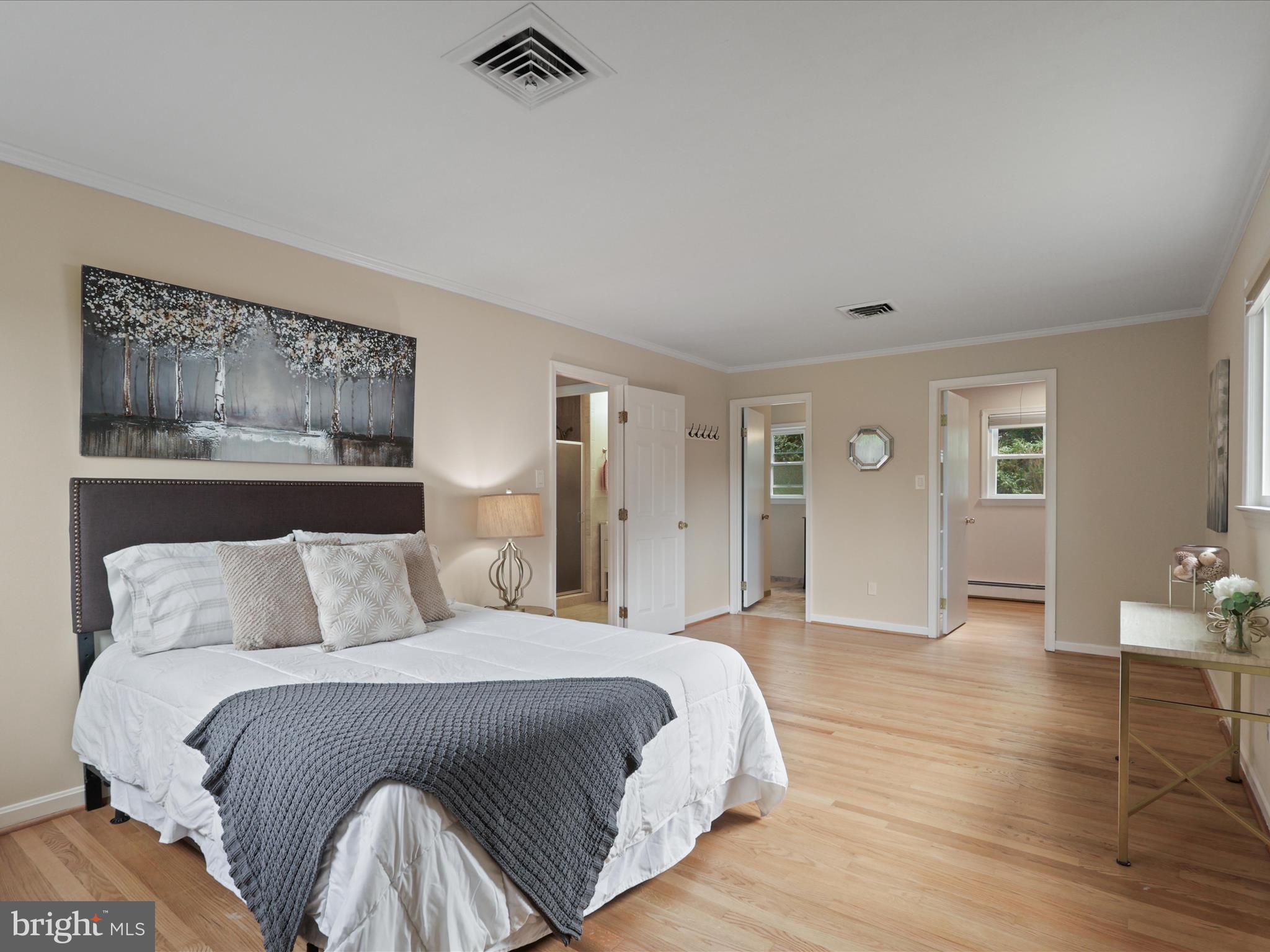 4417 Laurel Road Alexandria, VA 22309 - Photo 17 of 46 a bedroom with a bed and painting on the wall