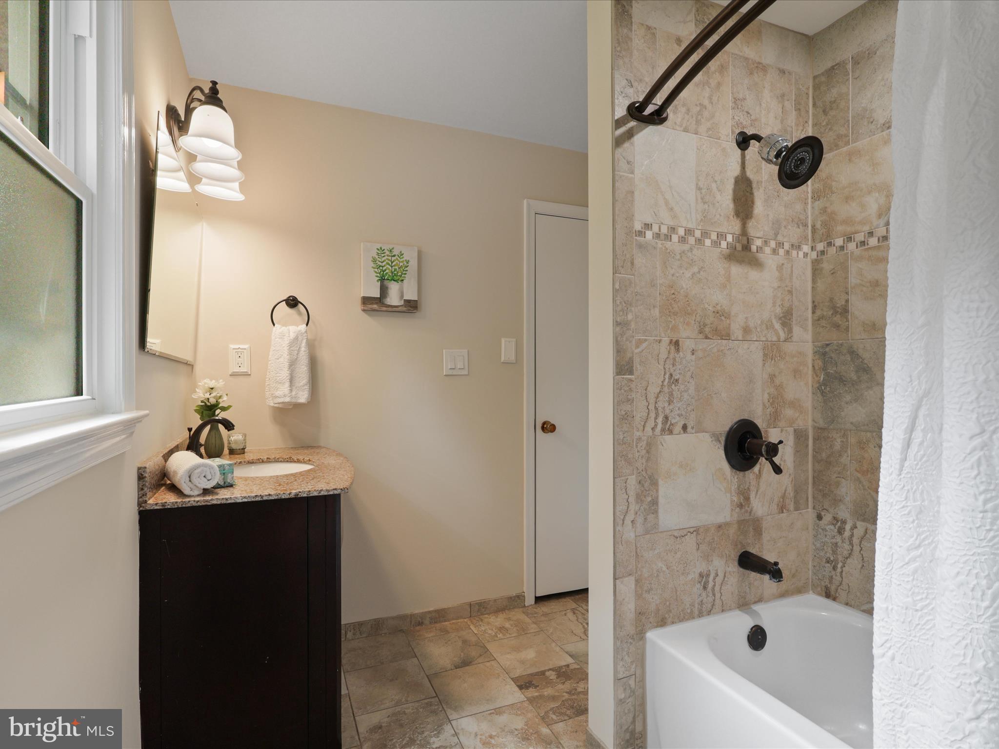 4417 Laurel Road Alexandria, VA 22309 - Photo 19 of 46 a bathroom with a sink and a mirror