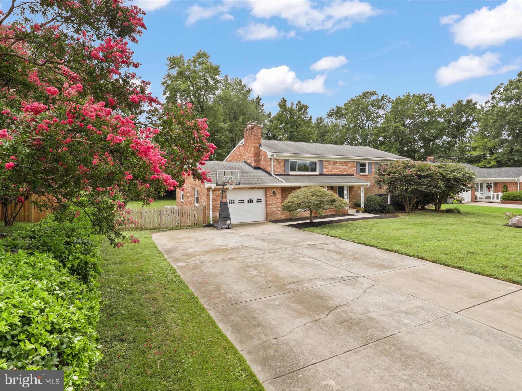 4417 Laurel Road Alexandria, VA 22309 - Photo 2 of 46 a car parked in front of house with yard