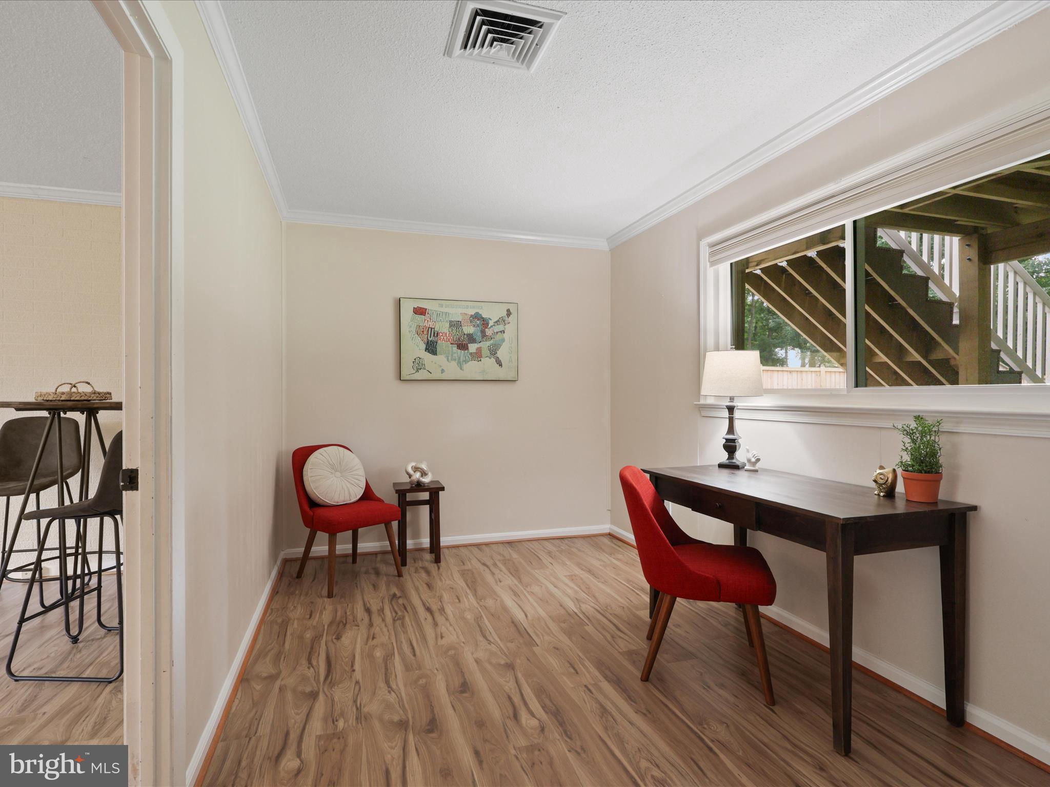 4417 Laurel Road Alexandria, VA 22309 - Photo 24 of 46 a view of a workspace with furniture window and wooden floor