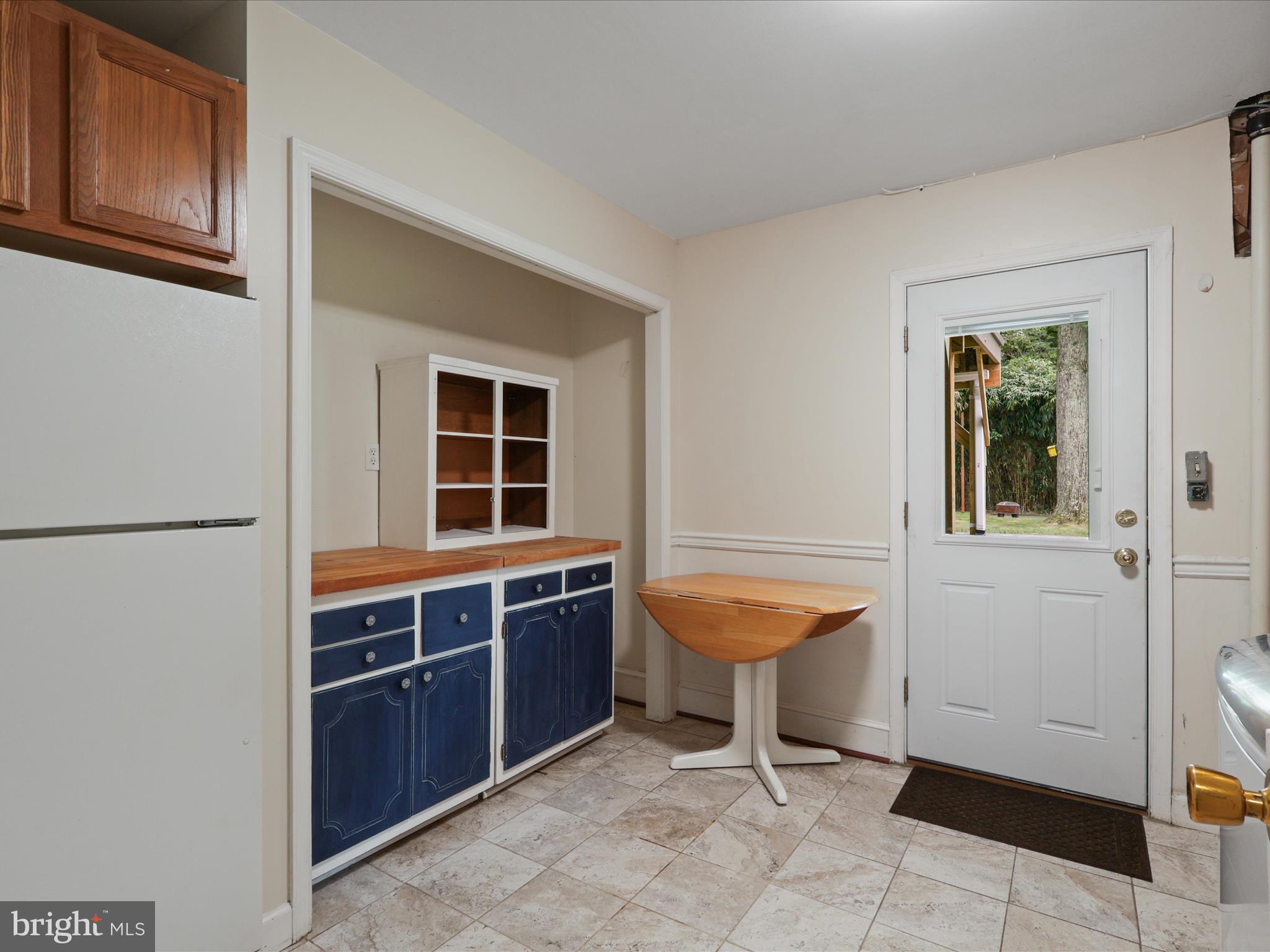4417 Laurel Road Alexandria, VA 22309 - Photo 30 of 46 a view of a room with a table and chairs