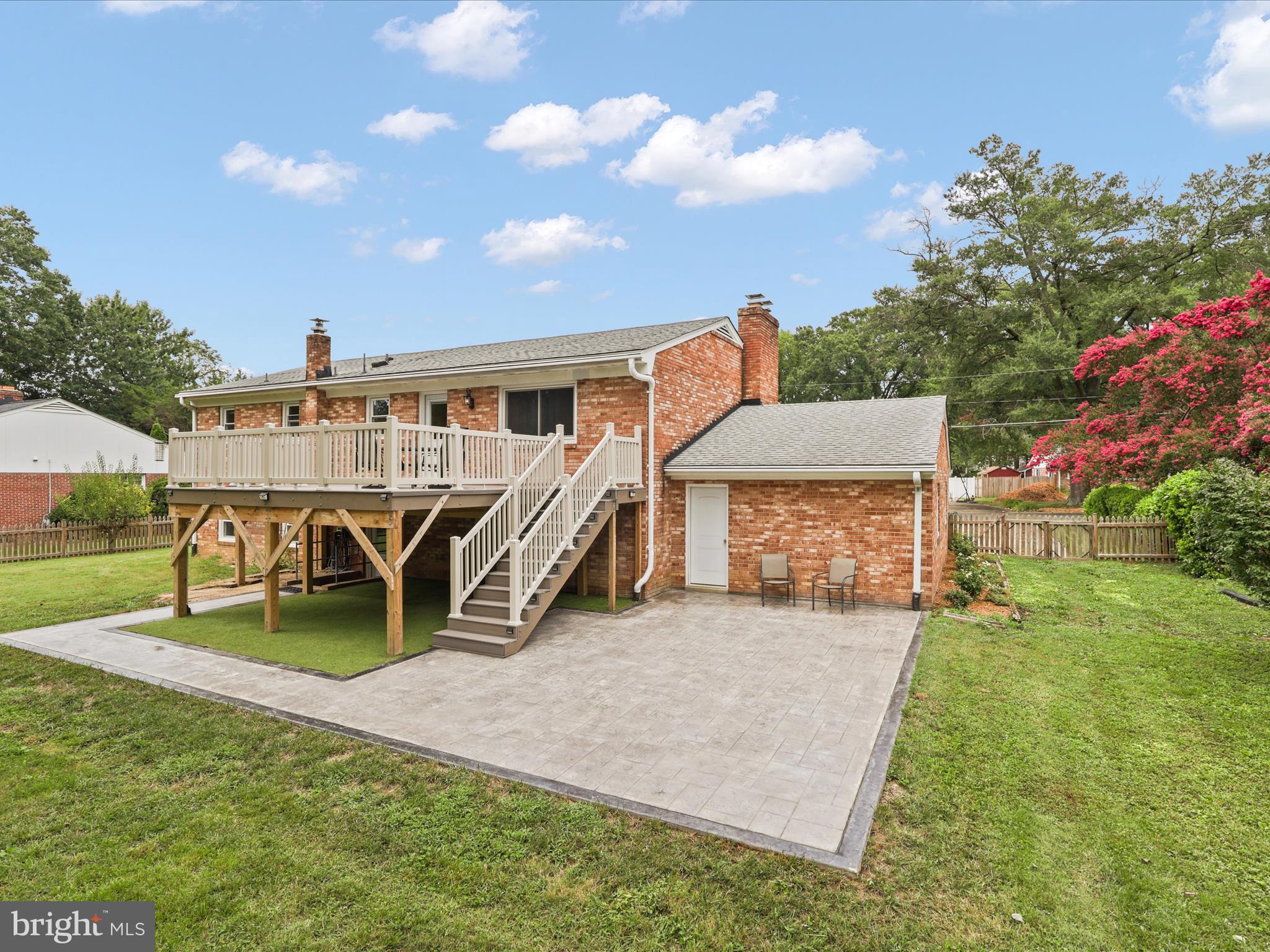 4417 Laurel Road Alexandria, VA 22309 - Photo 33 of 46 a view of a house with a yard and sitting area